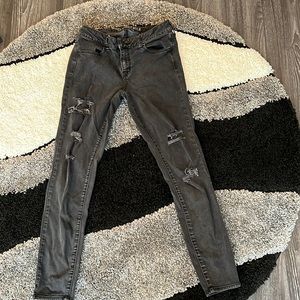 Washed out black ripped jeans. Size 10